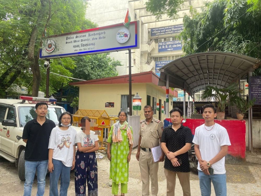 The rescued woman with officials of a student union in Delhi at Kishangarh Police Station.