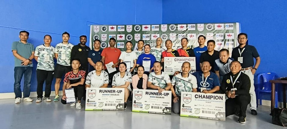 Winners of 4th Inter-Department Badminton tournament 2024 with Kovi Meyase and others on August 17. (Morung Photo)