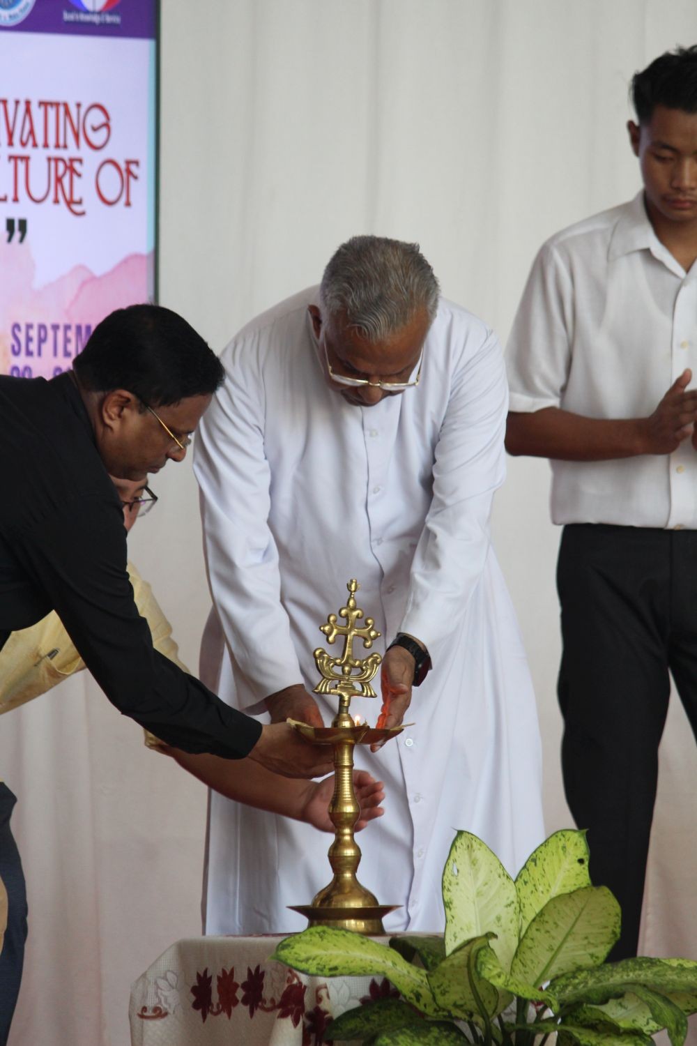 The ceremonial lighting of the lamp being done before the beginning of the Peace Knit Fest.