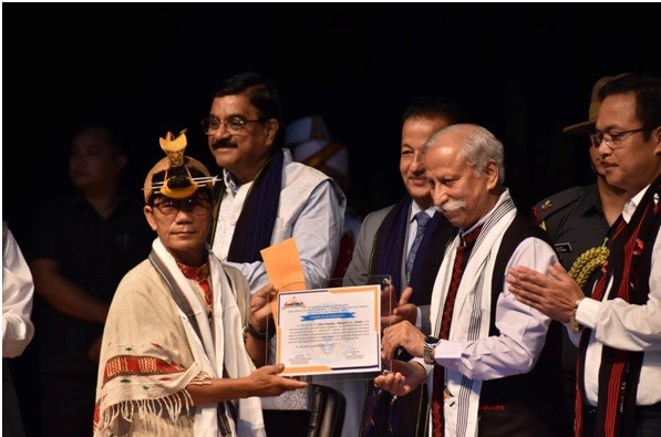 A certificate being awarded during the celebration of MIthun Day.