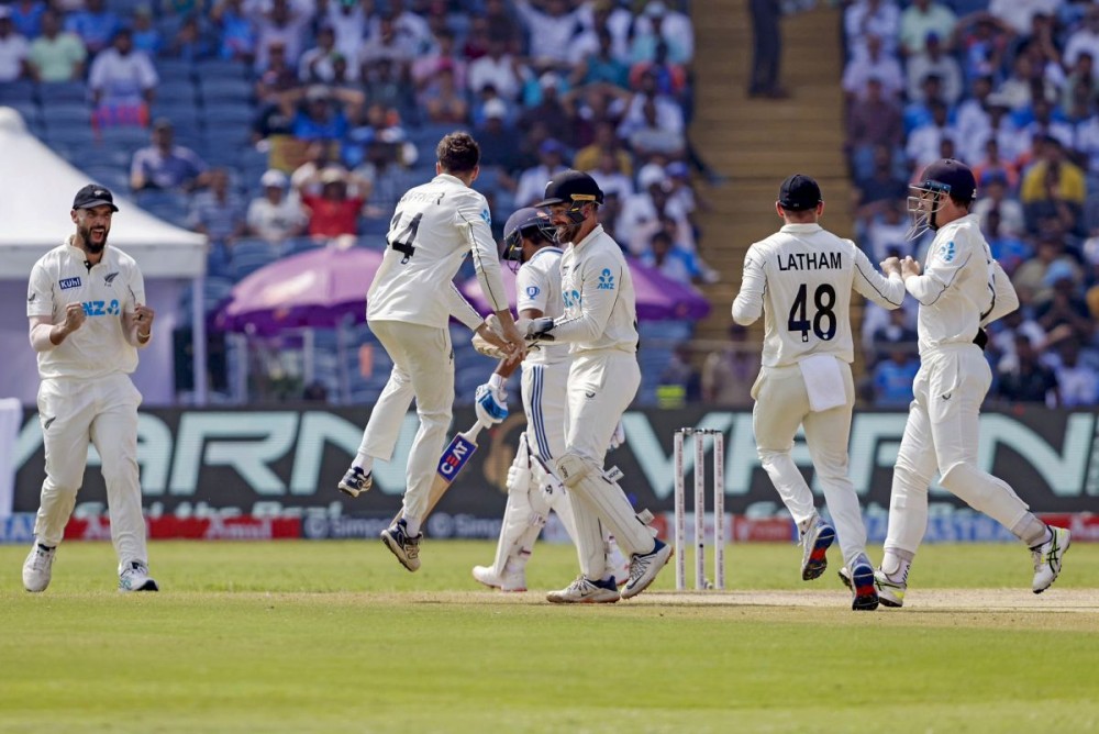 Pune: New Zealand's Mitch Santner celebrates after taking the wicket of India's captain Rohit Sharma with teammates on day three of the second cricket Test match between India and New Zealand at the Maharashtra Cricket Association Stadium in Pune on Saturday, October 26, 2024. (Photo: IANS/@BCCI)