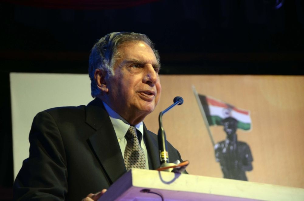Mumbai: Tata Sons chairman emeritus Ratan Tata felicitates retired police officer Suryakant Jog during a programme  in Mumbai, on Dec 23, 2015. (Photo: IANS)