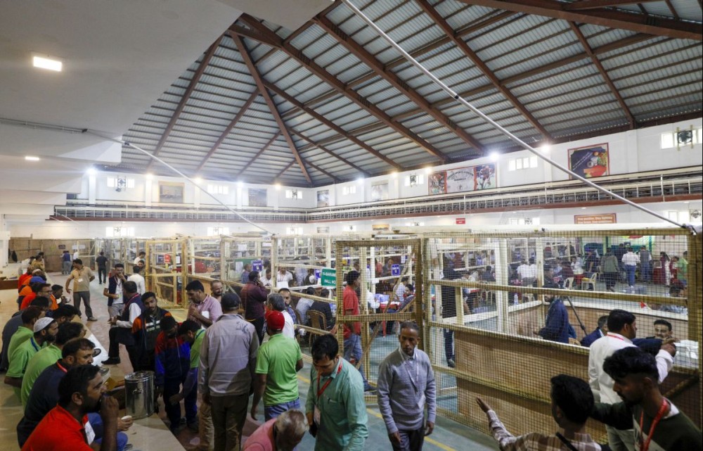 Baramulla: Counting officials tally votes after the Jammu and Kashmir assembly election at Indoor Sports Stadium in Baramulla on Tuesday October 08, 2024. (Photo: IANS/Nisar Malik)