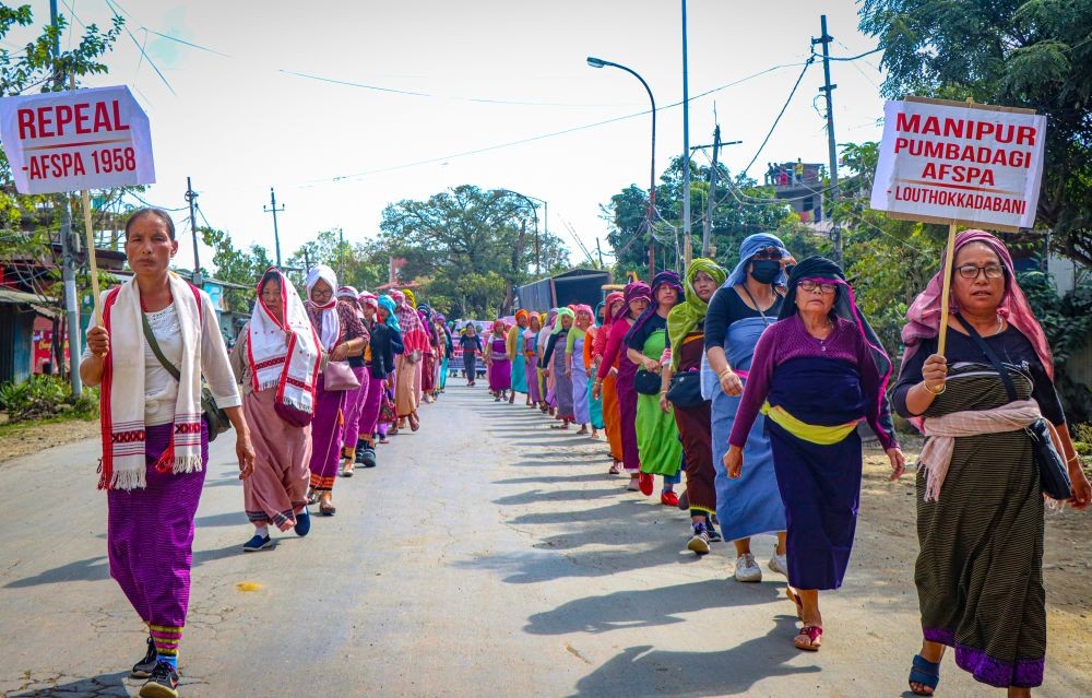 Imphal East: Thousands of women Meira Paibis lead a mass protest rally, demanding justice for recent killings in Jiribam and the repeal of AFSPA, in Manipur on Monday, November 25, 2024. (Photo: IANS)