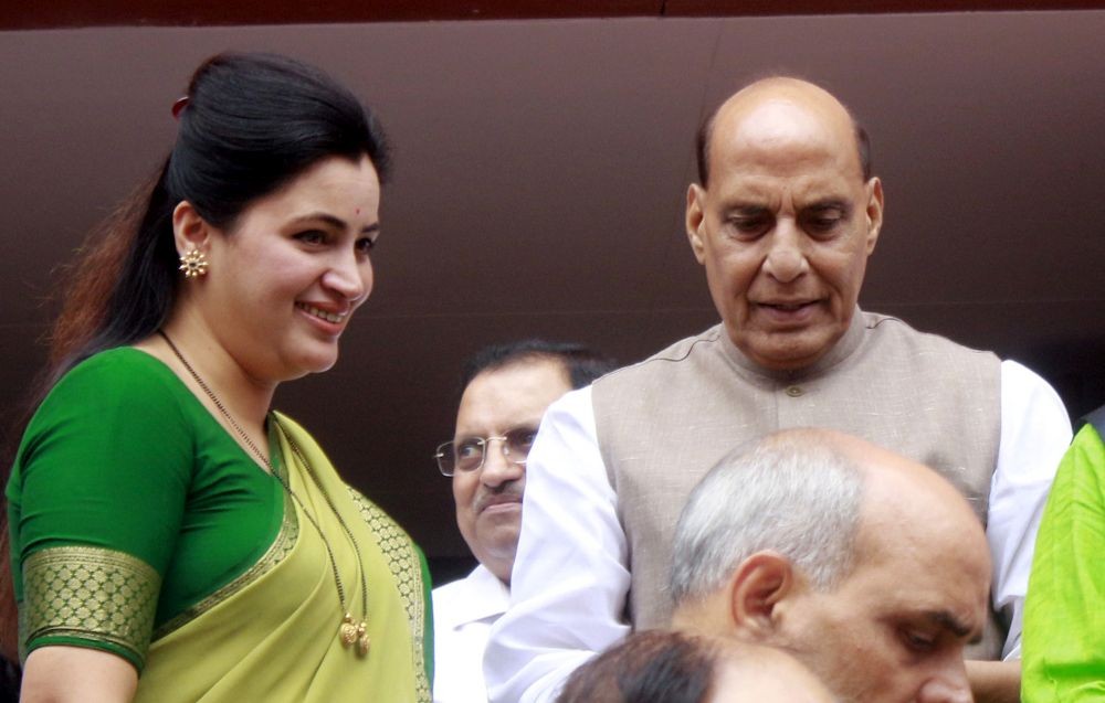 New Delhi :Union Minister of Defence Rajnath Singh with Former MP Navneet Kaur Rana  at the Parliament House during the first session of the 18th Lok Sabha, in New Delhi on Thursday, June 27, 2024. (Photo: IANS/Qamar Sibtain)