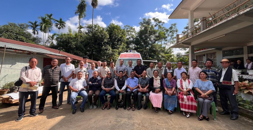 Representatives from various organizations gathered for the dedication of the community ambulance, a valuable healthcare resource for Jalukie 'B'.