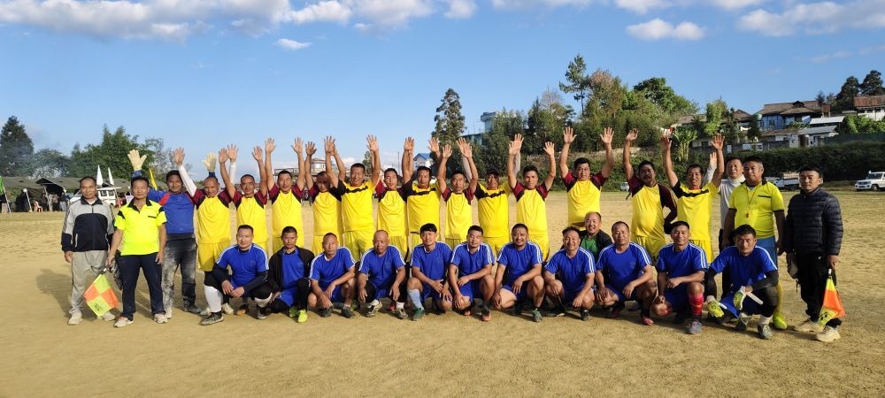 Penalty Shootout winner team New Ministers Hill/Aradura (Yellow Jersey) and runner-up team Lower Forest (Blue Jersey) posing lens with the umpires right after the final match. (Photo Courtesy: Kuzhovesa Soho)