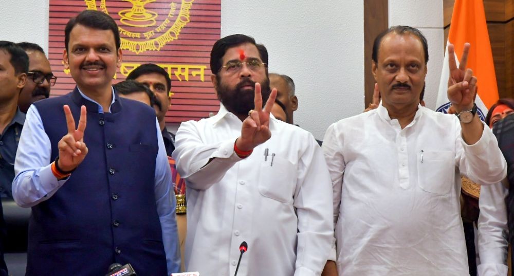 Mumbai: Maharashtra CM Eknath Shinde, Deputy CMs Devendra Fadnavis and Ajit Pawar flash victory signs during a press conference following the Mahayuti alliance's victory in the Maharashtra Assembly elections in Mumbai on Saturday, November 23, 2024. (Photo: IANS/Nitin Lawate)