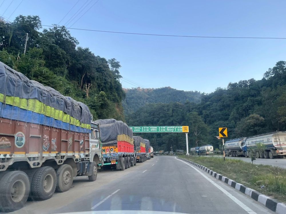 Stranded trucks along the NH-29 Dimapur Bypass on the afternoon of November 19. The restriction on heavy motor vehicles with more than three axles, preventing travel beyond Chathe River Bridge towards Kohima since 11 PM on October 25, was lifted on November 19. (Morung Photo)