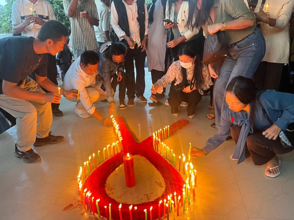 Attendees lighting candles in commemoration of World AIDS Day held at CPO Hall, Chümoukedima on December 1. (Morung Photo)