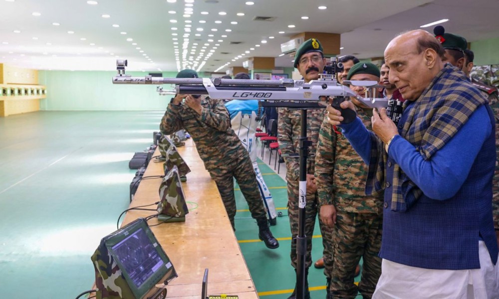Mhow: Defence Minister Rajnath Singh tries his hand on a weapon at the Vijay Shooting Range in Mhow on Sunday, December 29, 2024. (IANS)
