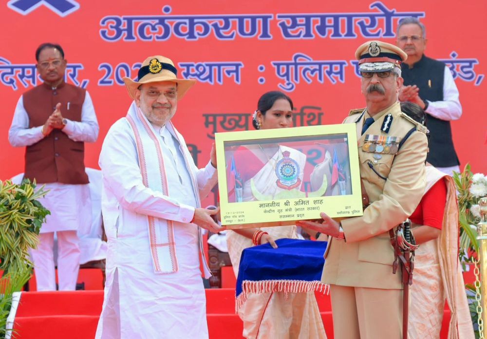 Raipur: Union Home Minister Amit Shah attends a ceremony to honour the Chhattisgarh Police with the ‘President’s Colours Award’ at the Police Parade Ground in Raipur on Sunday, December 15, 2024. (Photo: IANS)
