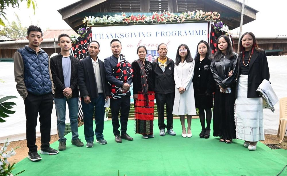 K Sudanvito Justin (fourth from left) with family and others during the thanksgiving programme held at Kiusam town on December 21.