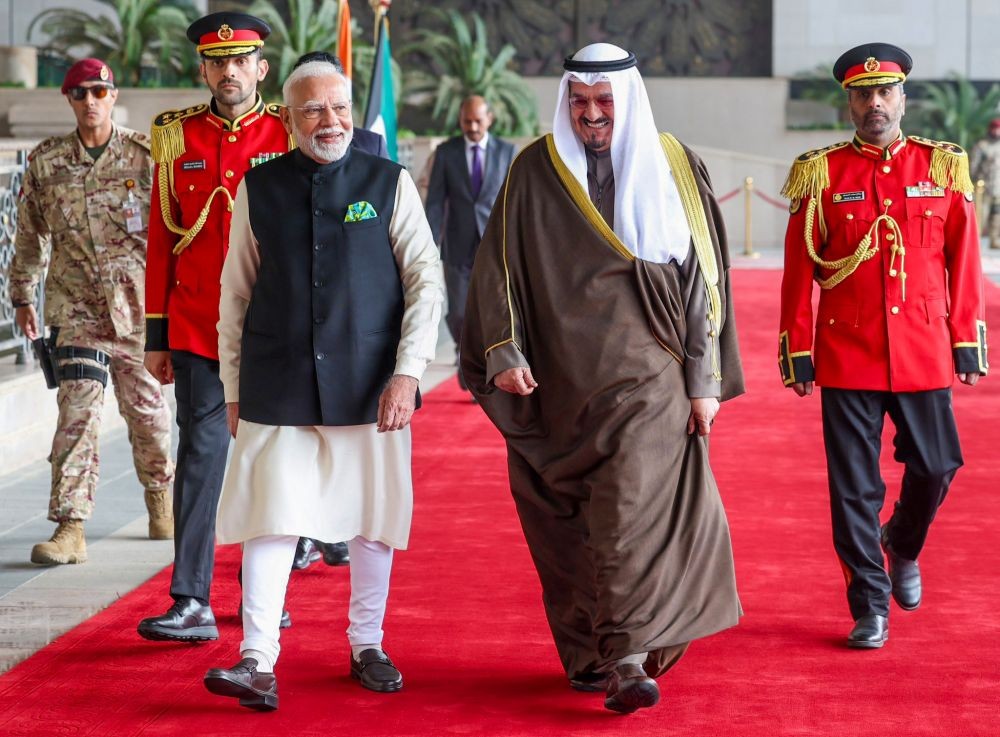 Kuwait: Prime Minister Narendra Modi is accorded a ceremonial guard of honour at the Bayan Palace in Kuwait on Sunday, December 22, 2024. The Amir of Kuwait, Sheikh Meshal Al-Ahmad Al-Jaber Al-Sabah, is also present. (Photo: IANS)