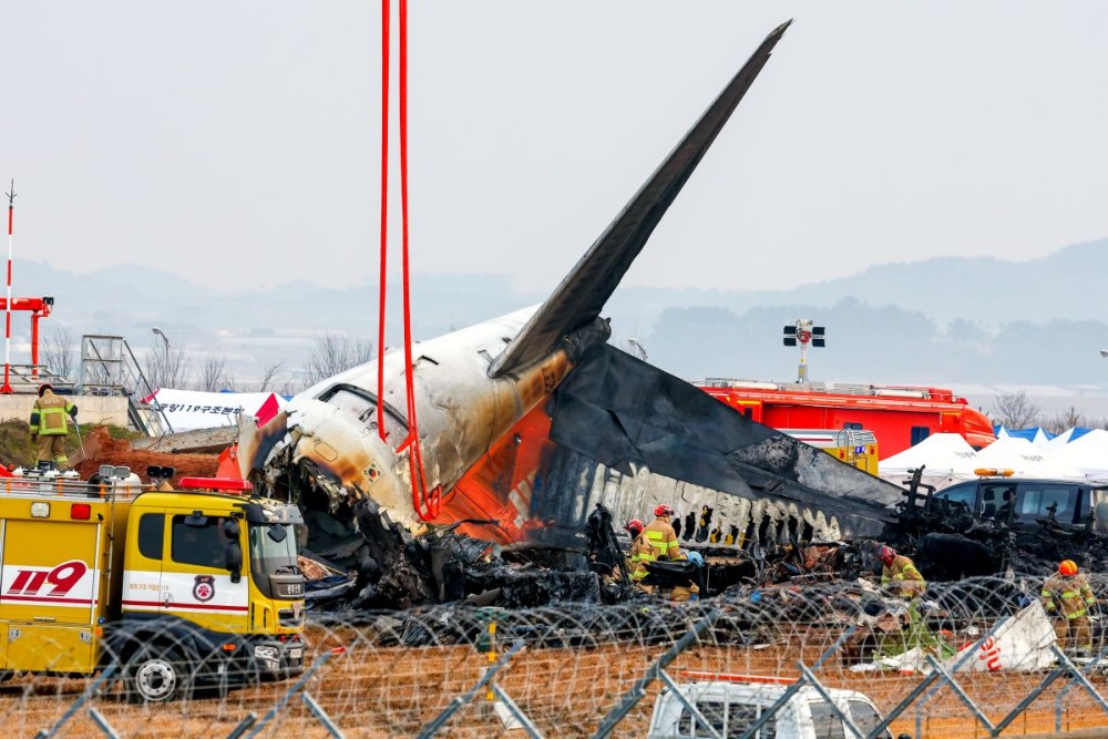 Muan: Firefighters carry out search operations at Muan International Airport in the southwestern county of Muan on Dec. 30, 2024, after a Jeju Air passenger plane with 181 people aboard crashed the previous day. (Photo: IANS/Yonhap)