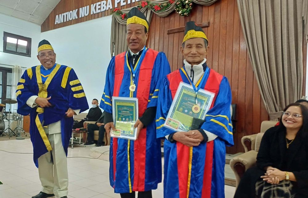 Neingulo Krome and Saneilie Venyo with Rev. Dr. D.L. Sanchu on December 22.