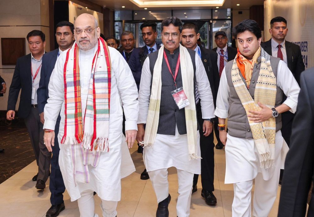 Agartala: Union Home Minister Amit Shah, Union Minister Jyotiraditya Scindia, and Tripura Chief Minister Manik Saha during the North East Bankers' Conclave 2024 in Agartala on Saturday, December 21, 2024. (Photo: IANS)