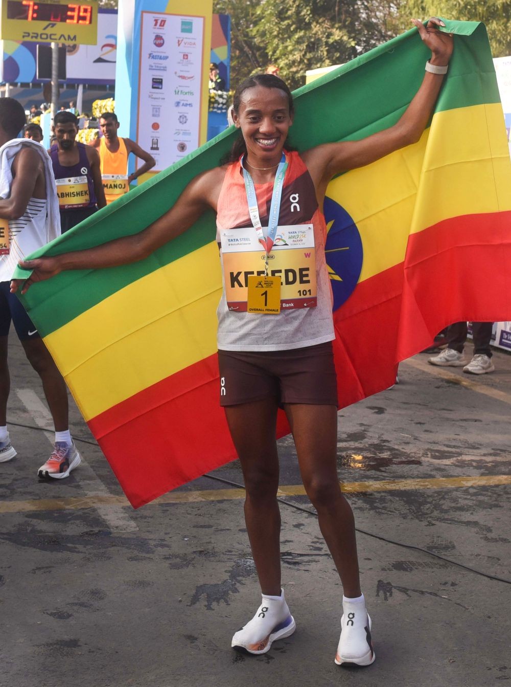 Kolkata: Sutume Kebede (Ethiopia) celebrates her victory after securing first place in the women’s category during the TATA Steel World 25K run held in Kolkata on Sunday, December 15, 2024. (Photo: IANS/Kuntal Chakrabarty)
