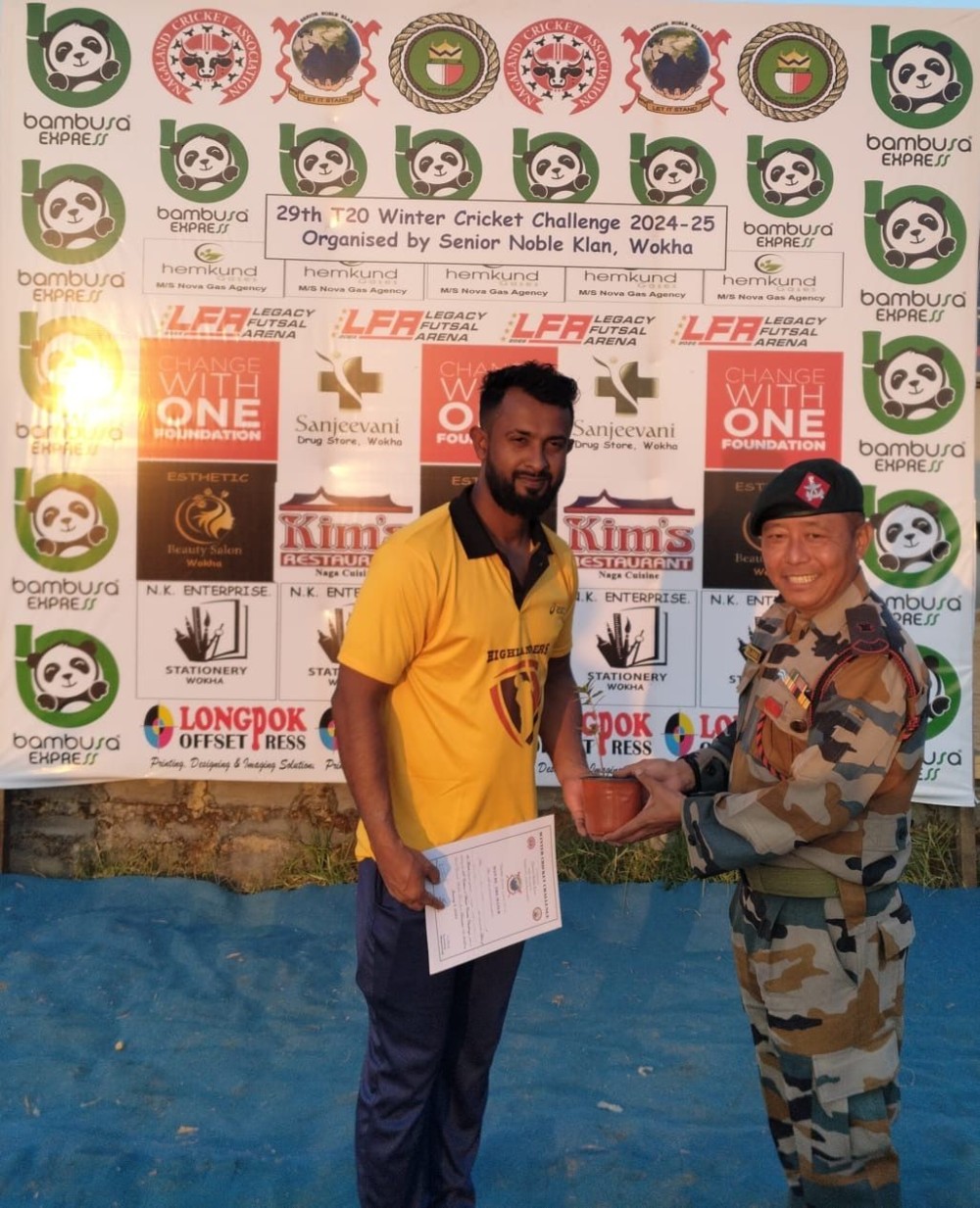 Maj. John Lama, Company Commander of 24AR, presents the Man of the Match award.