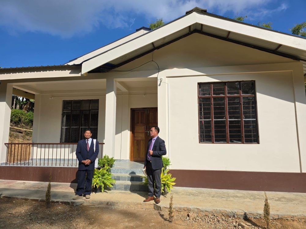 Rev. Thungjanshio Pastor Phiro Baptist Church (R) offering the dedicatory prayer on  January 19 for the memorial staff quarter constructed and gifted by the daughters of Phiro village (married with non Phiro sons) to Phiro Baptist Church to commemorate the upcoming centenary Jubilee. (DIPR Photo)