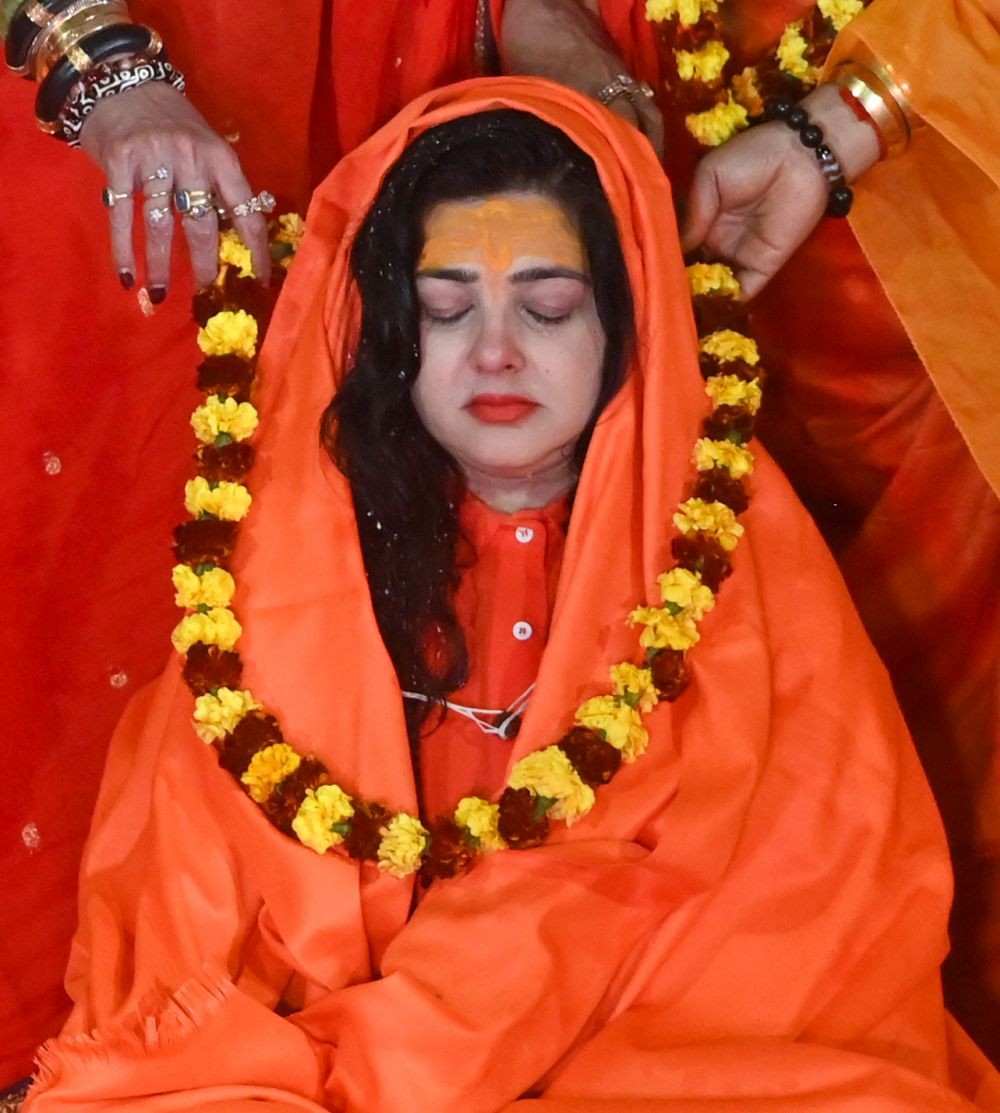 Prayagraj: Indian former actress and model Mamta Kulkarni, adorned as Mahamandleshwar of the Kinnar Akhara, performs sacred rituals during the ongoing Maha Kumbh Mela in Prayagraj on Friday, January 24, 2025. (Photo: IANS)