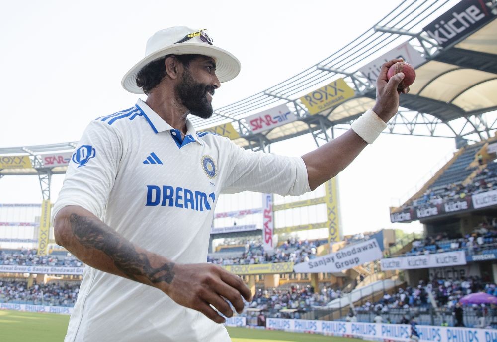 India's Ravindra Jadeja holds up the ball to celebrate his five-wicket haul during the third day of the third cricket Test match between India and New Zealand at Wankhede Stadium in Mumbai on Sunday, November 3, 2024. (Photo: IANS/@BCCI)