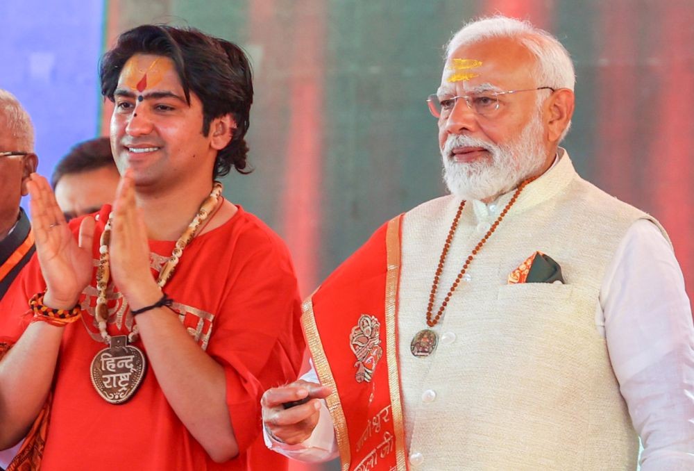 Chhatarpur: Prime Minister Narendra Modi and Dhirendra Krishna Shastri at the foundation stone-laying ceremony of Bageshwar Dham Medical and Science Research Institute for Cancer in Chhatarpur, Madhya Pradesh, on Sunday, February 23, 2025. (IANS)