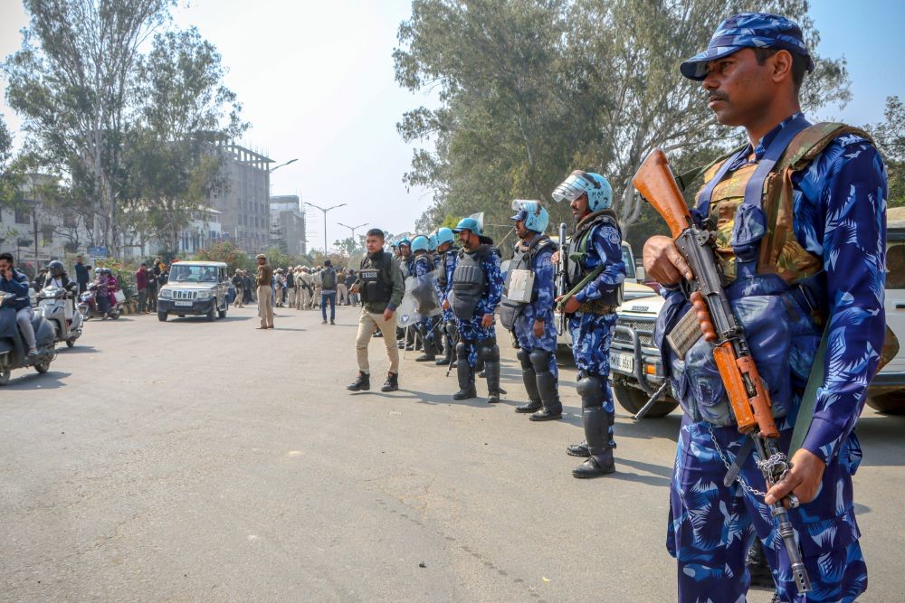 Imphal: Security forces, including RAF and Manipur Police, deployed at the War Cemetery entrance, block the FOCS-organized peace rally, preventing movement towards Senapati, in Imphal on Saturday, March 08, 2025. The rally was flagged off by Padma Shri awardee Aribam Shyam Sharma after Union Home Minister Amit Shah’s announcement of free highway movement. (Photo: IANS)