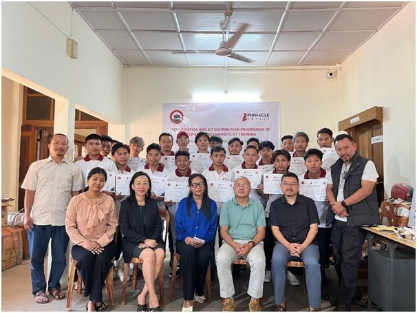 Participants of the Pinnacle Skills certification and kit distribution program for self-employed barbers (Batch 3) pose with officials and organizers.