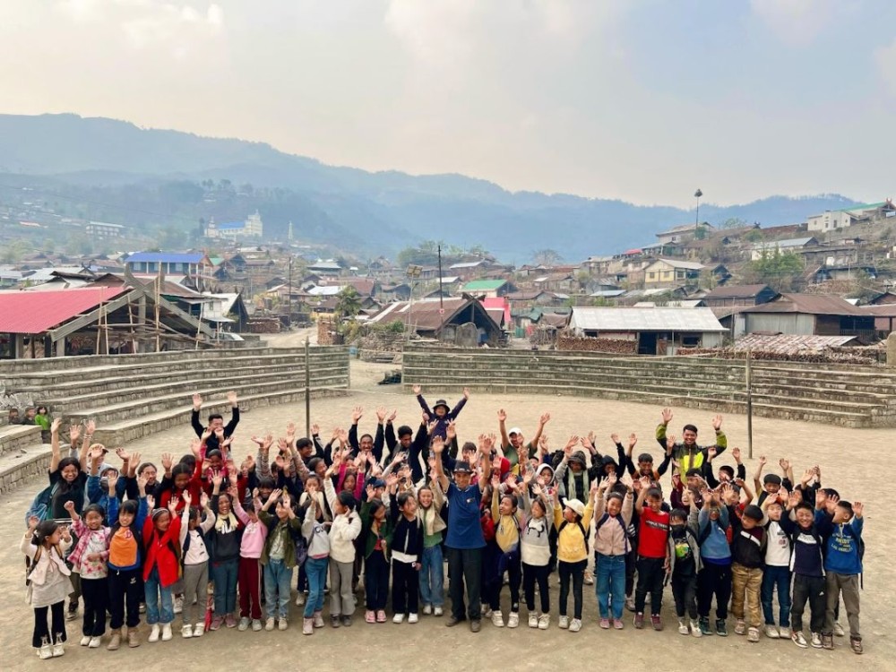 School children join in on the village walk at Zhavame on March 31.