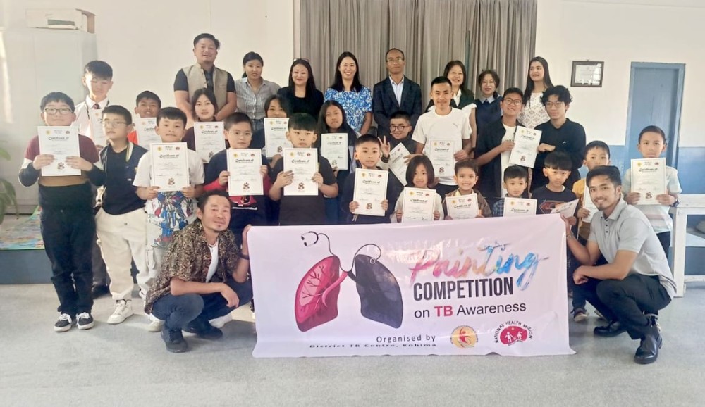 Dignitaries with winners and participants of painting competition on March 29.