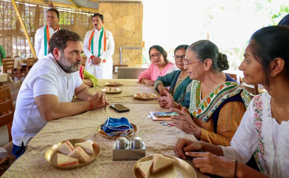 Ahmedabad: Leader of Opposition Rahul Gandhi visits Kamala Cafe, run by SEWA, on the occasion of International Women's Day in Ahmedabad on Saturday, March 08, 2025. (Photo: IANS)