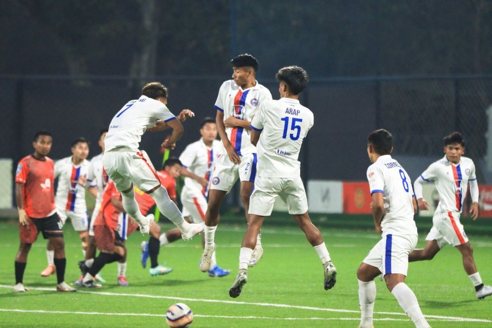 Longterok FC (White) and Red Scars FC (Red) players in action during their Matchday 12 clash of the ongoing Nagaland Super League at Chümoukedima Football Stadium on March 8. (Photo Courtesy: @NSLOfficial2024/X)