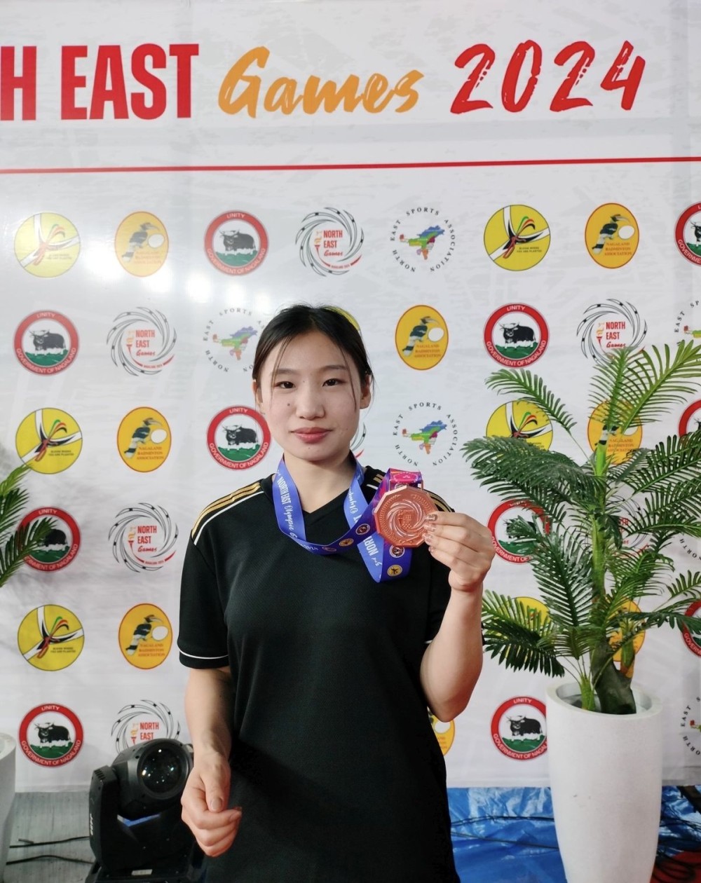 Erenbeni P Khuvung poses with her medal during the 3rd North East Games 2024, hosted by Nagaland.