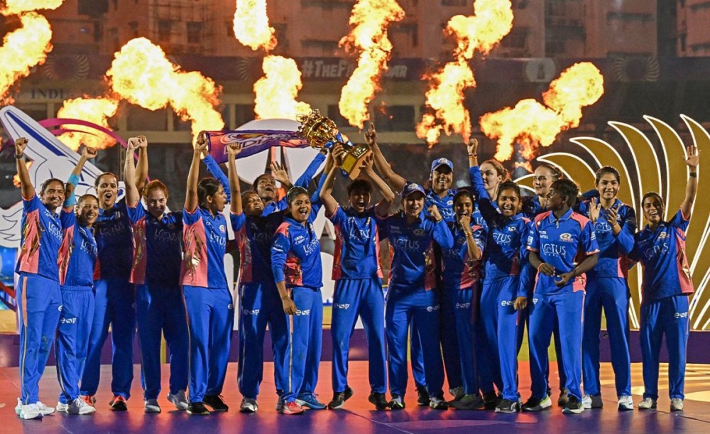 Mumbai: Mumbai Indians players celebrate with the winner's trophy after clinching the Women's Premier League 2025 final against Delhi Capitals at Brabourne Stadium in Mumbai on Saturday, March 15, 2025. (Photo: IANS/@wplt20)