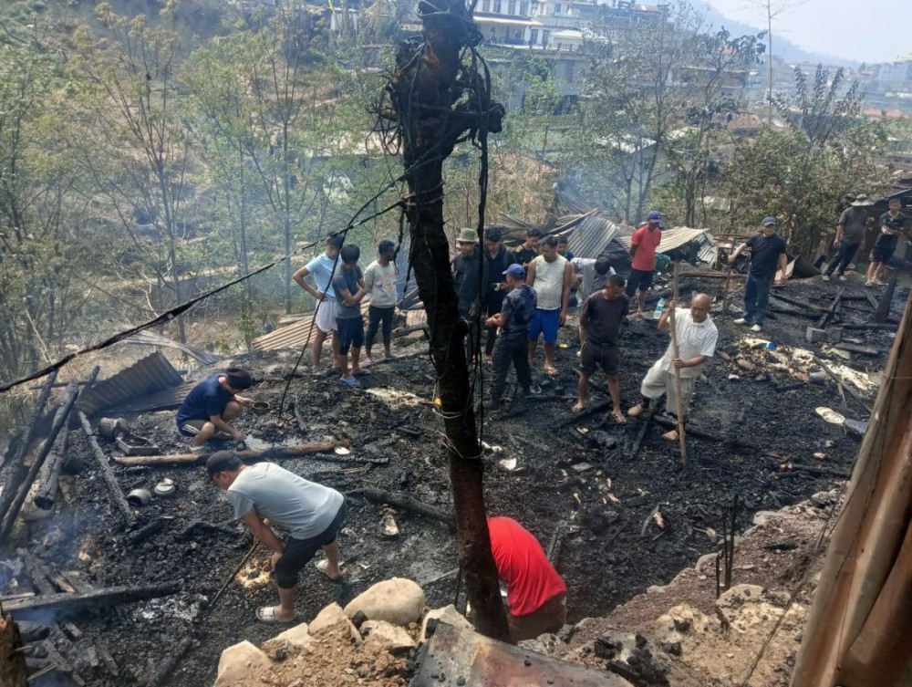 Residents and others inspect the remains of a house gutted by a fire at Officer’s Hill Colony, Kohima, April 2. The blaze destroyed three katcha houses, affecting six families. (Morung Photo)