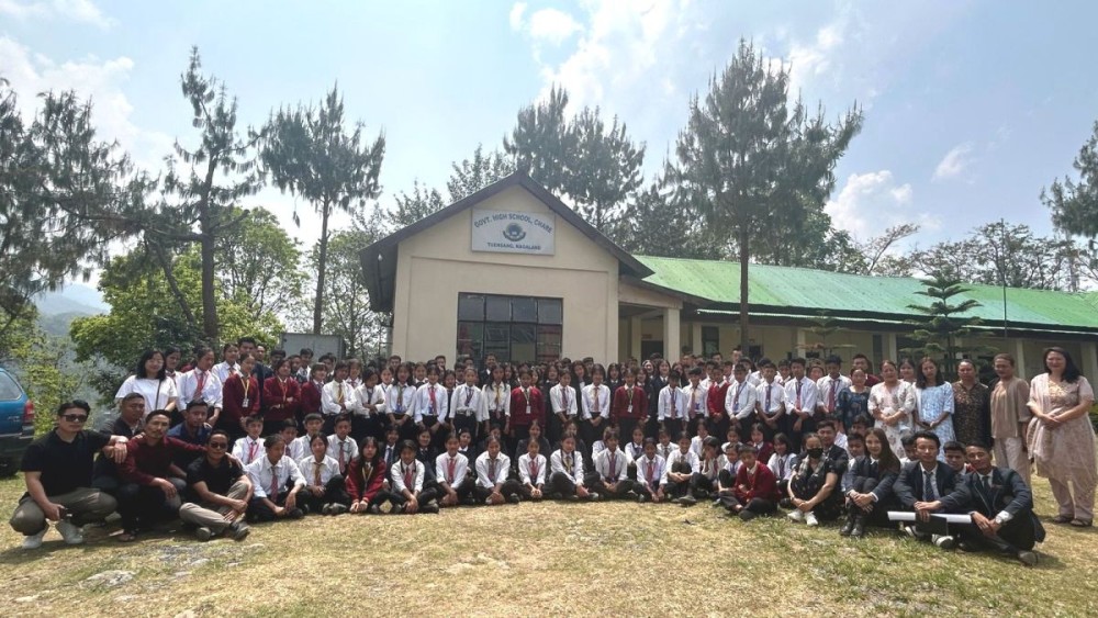 Students of Fazl Ali College, Mokokchung and Government High School Chare Town along with their teachers during an outreach programme held in Chare Town on April 10.