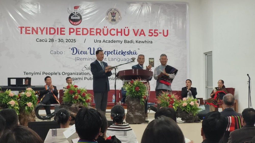 Dr. Shürhozelie Liezietsu, President, Ura Academy (M) releasing “Themia Khunuo Kemevi” written by Kethoselie Zhale (R) and Daso Pahino, Vice President, Ura Academy (L) at Ura Academy Badi, Kohima on May 28.
