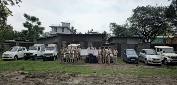 In this handout photo, Dimapur Police personnel are seen with members of the alleged criminal gang involved in the auto fraud racket. (Photo Courtesy: PRO Dimapur Police)