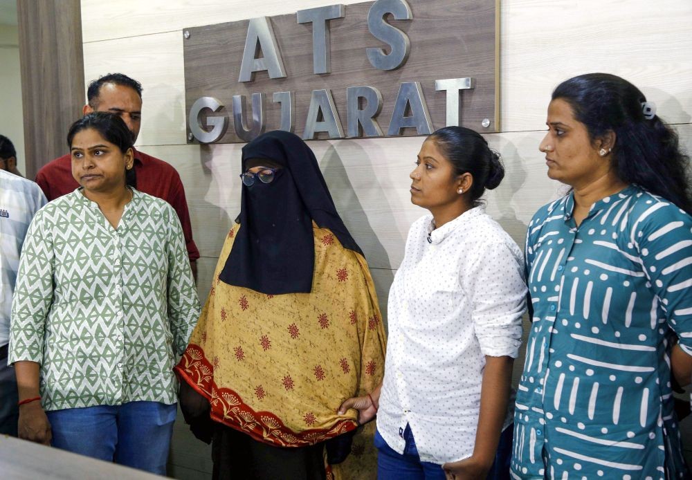 Gujarat ATS officials present a woman arrested from Bengaluru for her alleged involvement in bolstering Al Qaeda’s influence in India at the ATS office in Ahmedabad on Wednesday, July 30, 2025. (Photo: IANS)