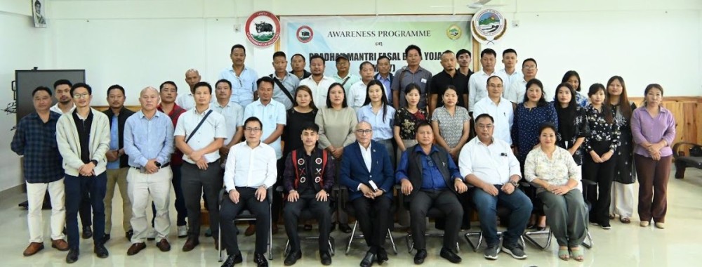 Dignitaries with participants of awareness programme on PMFBY in Kohima on July 17.