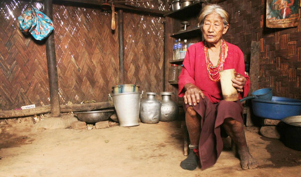 Anise, a 75 year old widow of Khumusu village, who still makes her own local brew.
