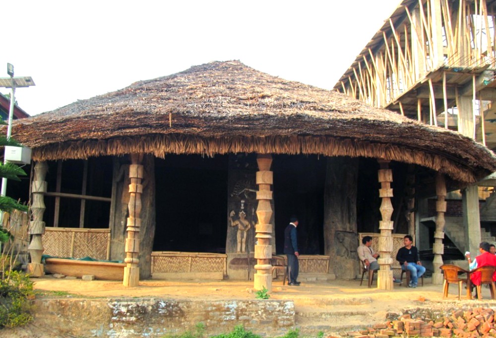 Tradition amidst development: The Angh’s house in Chetwetnyu village in Mon district still retains the traditional ‘tuko-patta’ roofing despite the village having achieved cent percent rural housing. On the right of the Angh’s house is the upcoming multi-purpose building and on the left is seen a solar street lamp