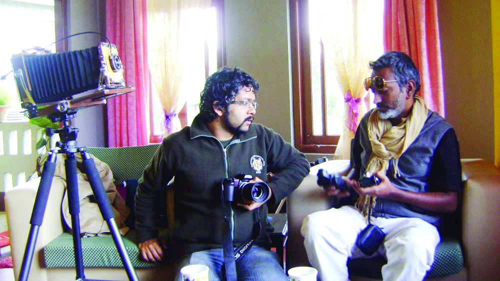 Chaitanya Guttikar (left) and Edson Dias of the Goa Centre for Alternative Photography at work during their recent visit to Mokokchung. Their alternative photography equipments list runs to a good number, which also includes a twin-lens reflex camera (TLR) and a Large Format Folding Camera (on the tripod).