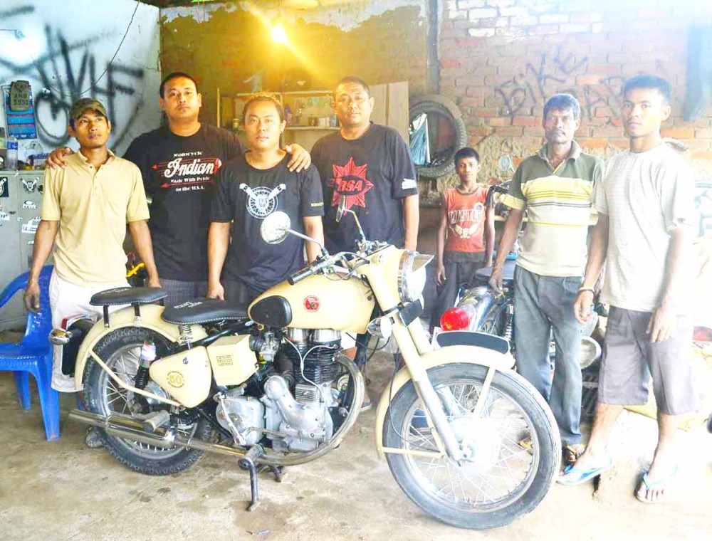 Danny Sangma (Fourth from Left) seen here at his Bike Barn along with his team of mechanics and well wishers.
