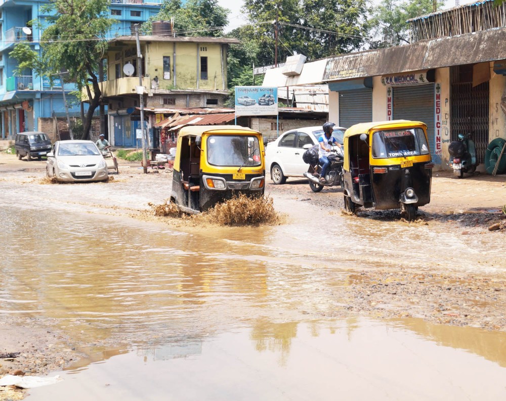 The road leading to Nagarjan in Dimapur has become a clogged basin, posing a threat to pedestrians, the sick, women in maternity and vehicles. (Photo by Akhrienuo Kire)