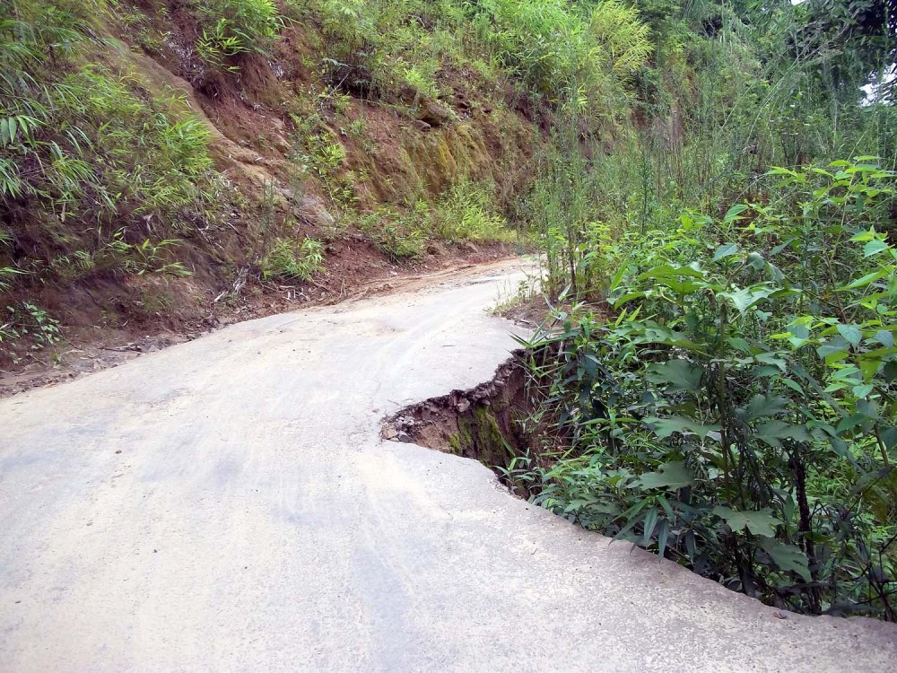 Two of the dozen cave-ins on the Dimapur-Jalukie Road via Khopanullah, a potential risk to vehicles plying in the dusk or night time.