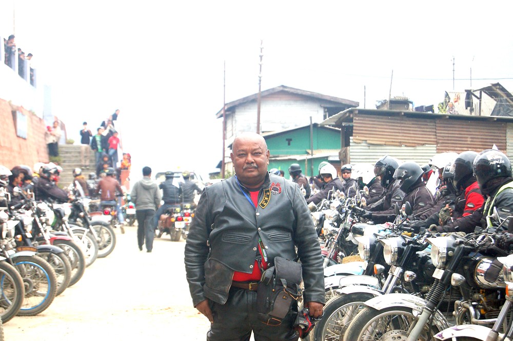 Rtd. Lt. Col. Sohan Roy poses with other participants of the Northeast Riders Meet at Bara Basti, Kohima