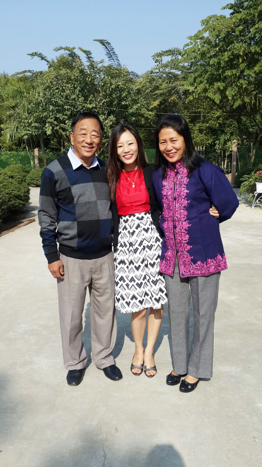 Cancer survivor Dr Tsusennaro with her parent KT Wapang and Imtiyala outside their home in Dimapur. (Morung Photo)