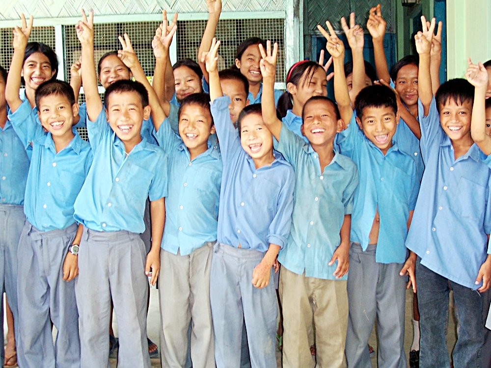 Hurrah! Students of the Community Education Centre (CEC) showing victory signs with joy as they pose for a photograph during a break. (MExPix)